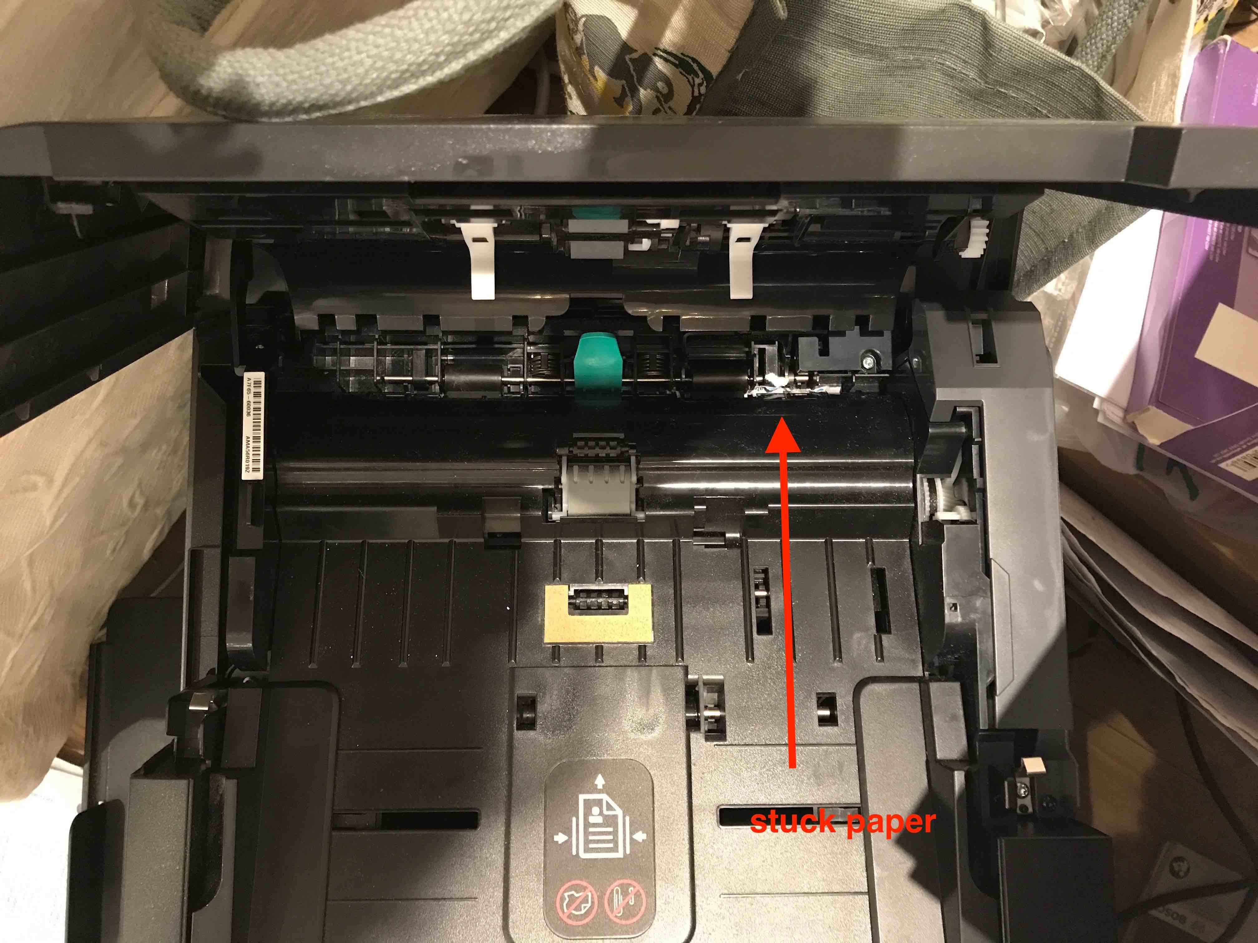 Solved: Paper stuck and unable to access - HP Support Community - 6260867