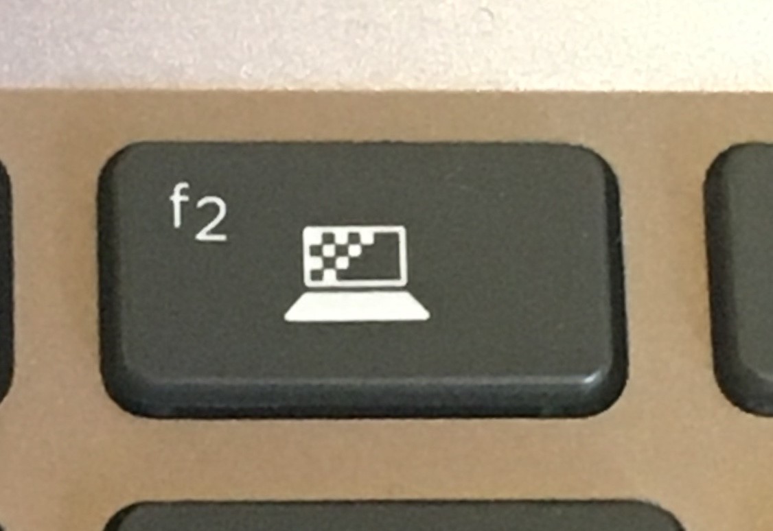 Solved: F2 icon that makes my screen dull - HP Support Community - 7140198