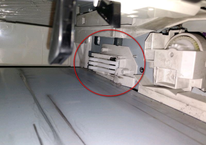 Printer cavity, switch board behind these white arms