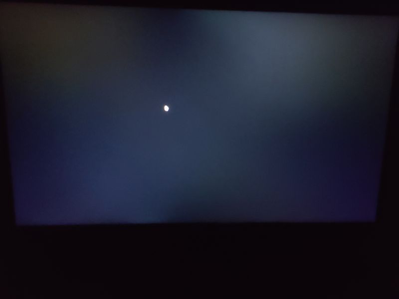 Black screen in dark environment. Taken from straight angle. Backlit keyboard was off.