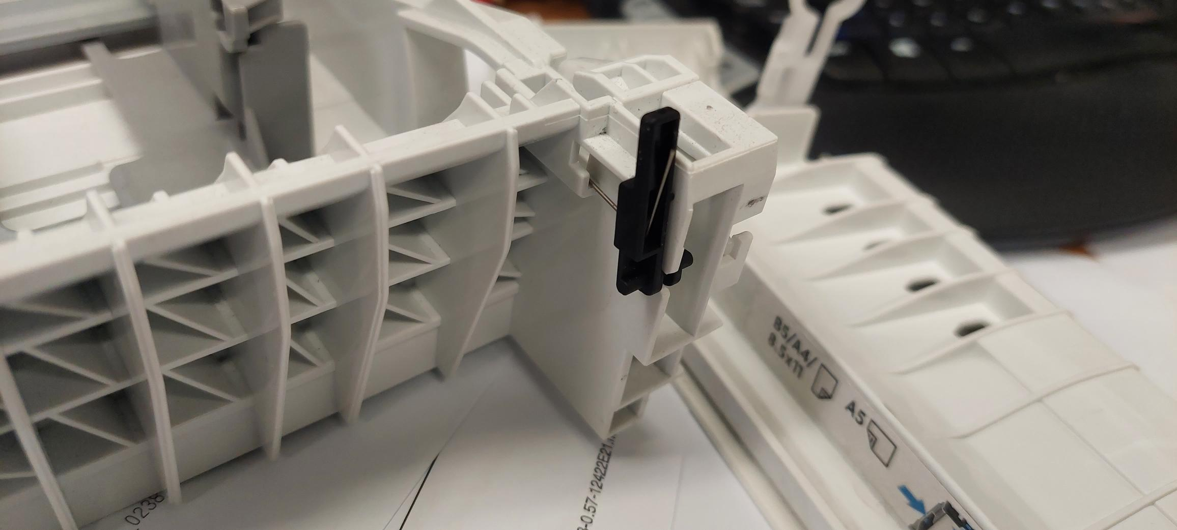 I need to identify a part a little black part came off tray