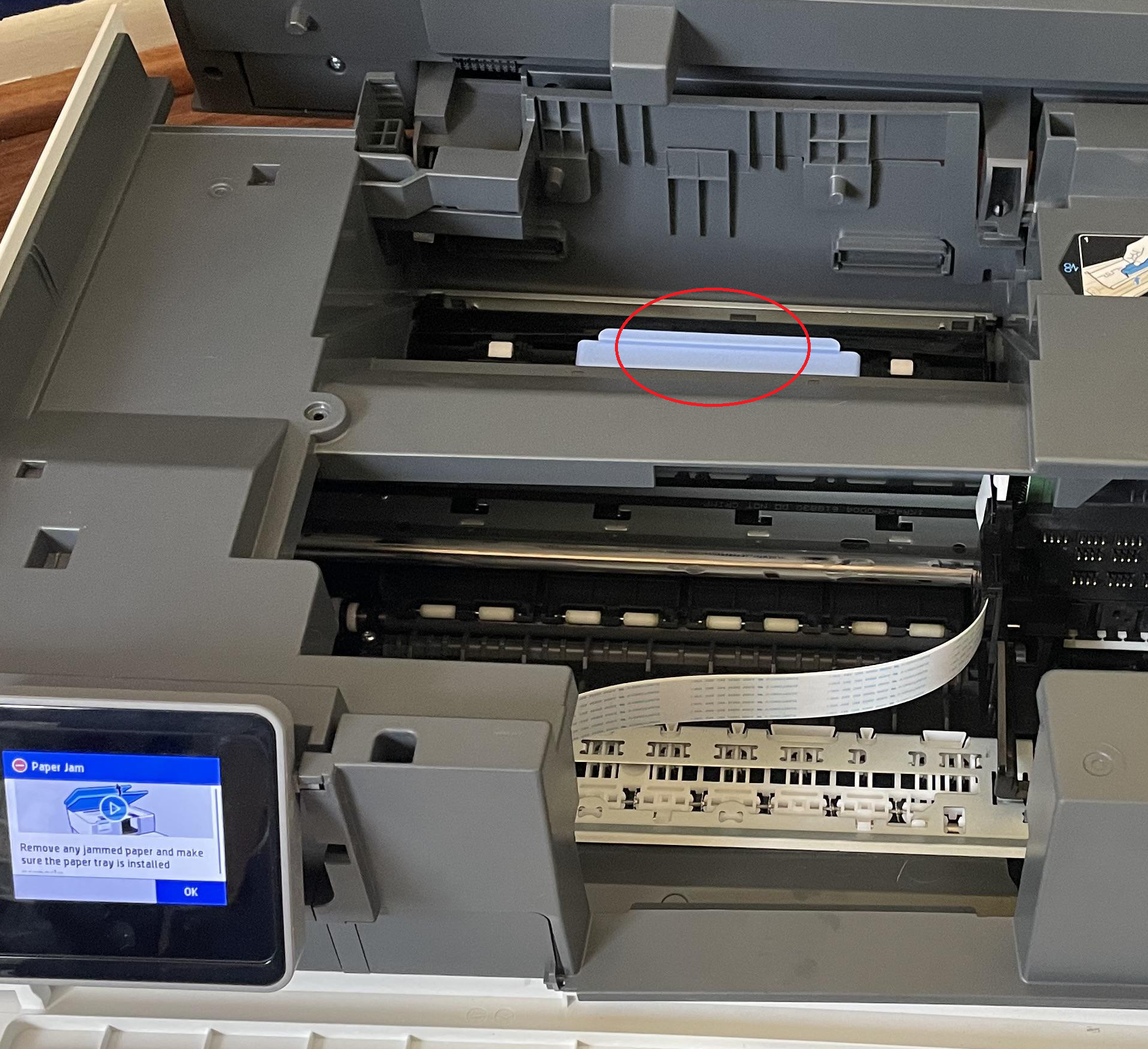 a white plastic strip with a spring on each end fell out of ... - HP ...